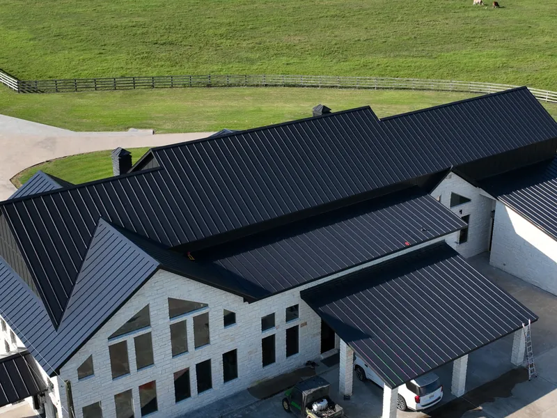 Standing seam metal roof types Standing seam metal roof types: a double-lock mechanically seamed matte black roof RISE Roofing installed near Hankamer, TX