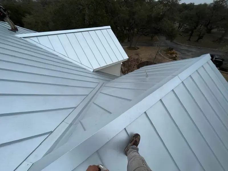 Silver standing seam metal roof on a rural Texas home