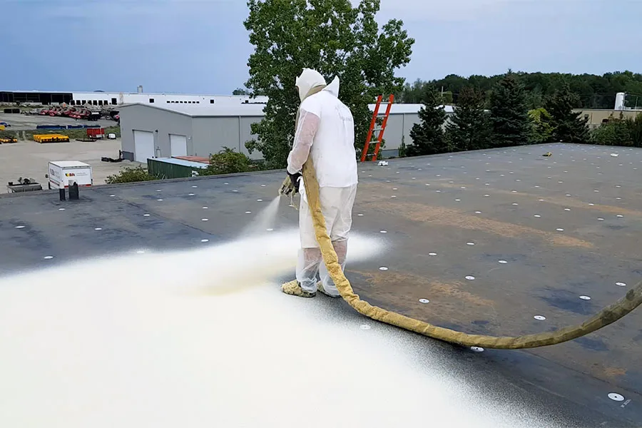 Roof coating application by RISE Roofing Houston