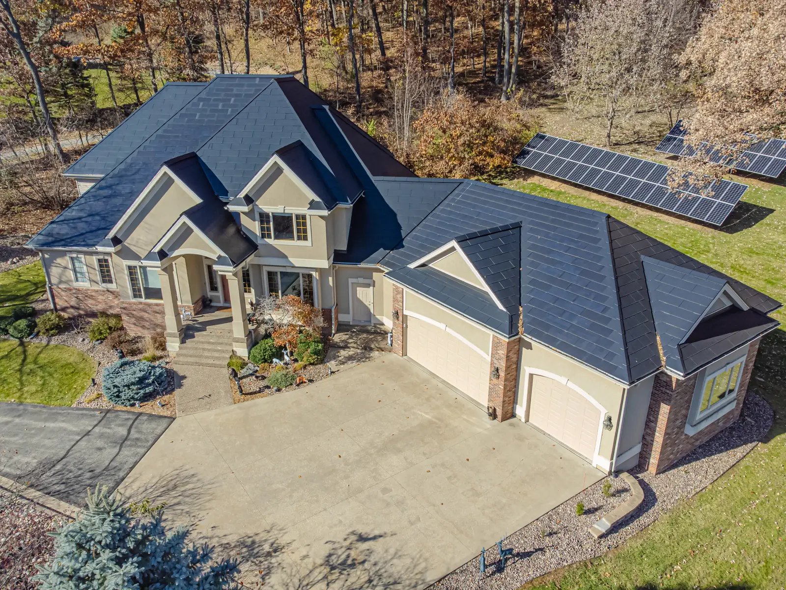 Tesla Solar Roof on a house in Onalaska, Wisconsin Tesla Solar Roof, now discontinued, covering a two-story house in Onalaska, Wisconsin, seen from a drone